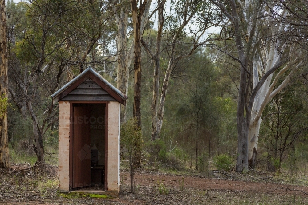 Long drop outside toilet on bush block : Austockphoto Long drop outside toilet on bush block - Australian Stock Image