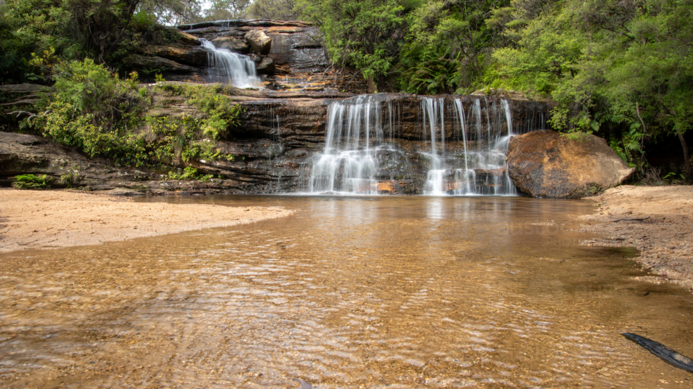 Long exposure of a waterfall near Wentworth Falls in the Blue Mountains - Australian Stock Image