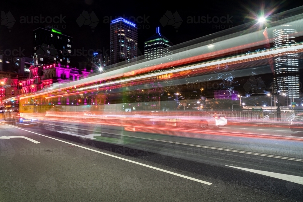 Long exposure of bus going past - Australian Stock Image