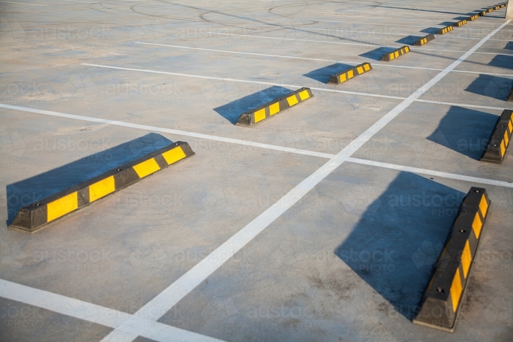 Long shadows in empty car park - Australian Stock Image