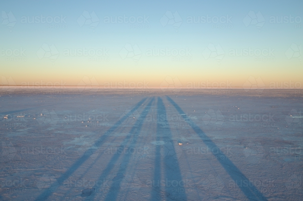long shadows on salt lake - Australian Stock Image