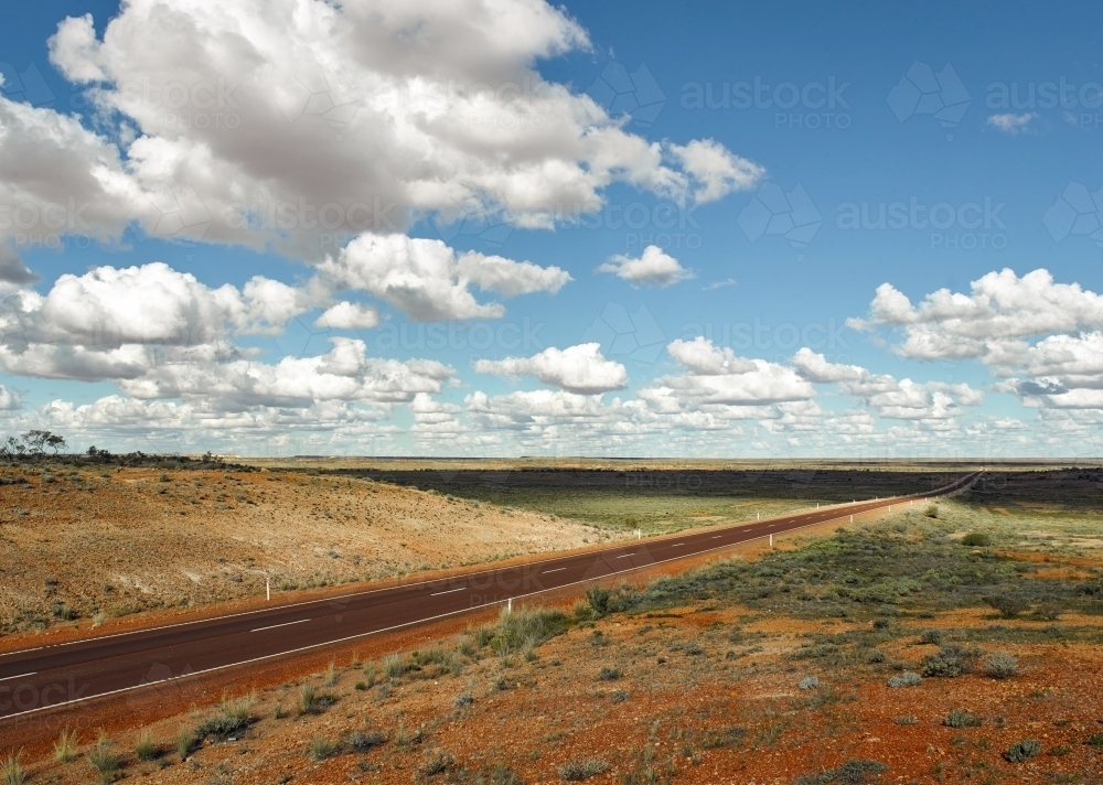 Long straight highway and landscape in outback - Australian Stock Image