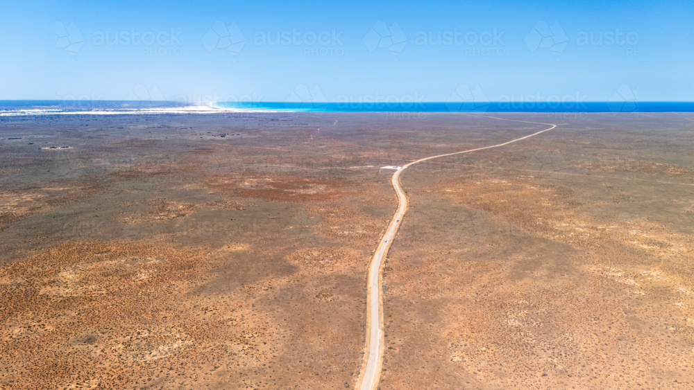 Long straight road on a vast barren land. - Australian Stock Image