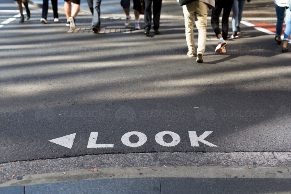 Image of Look sign on a road at a busy intersection in the Sydney CBD ...