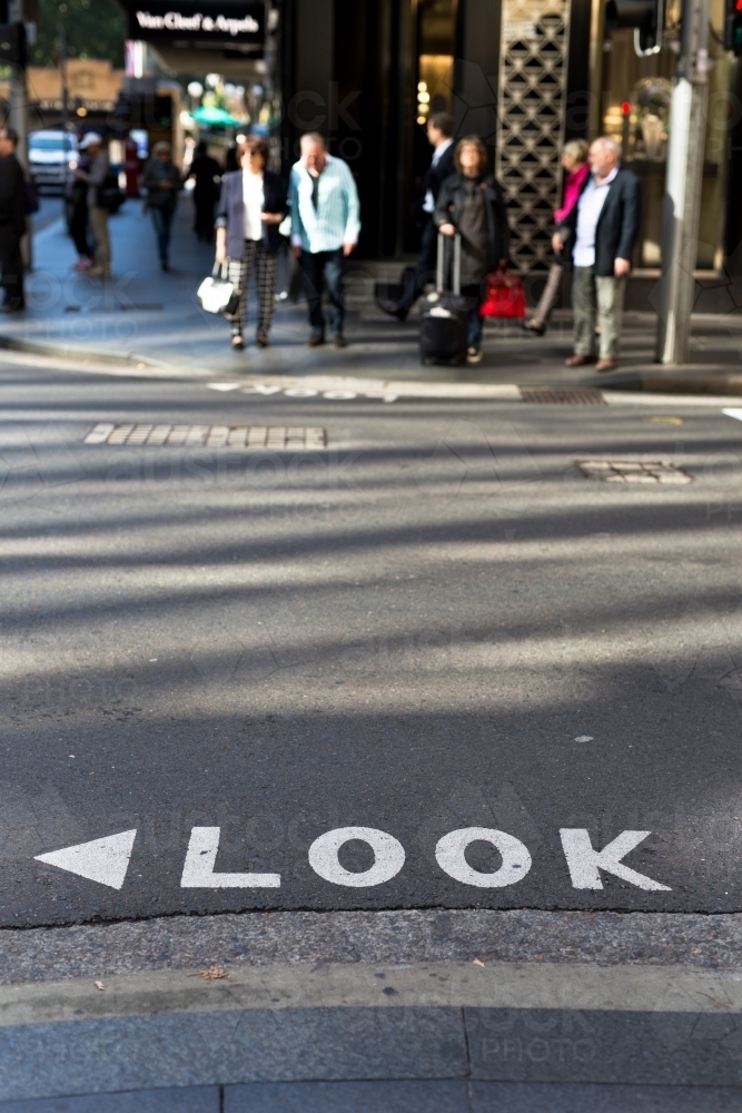Image of Look sign on a road at a busy intersection in the Sydney CBD ...