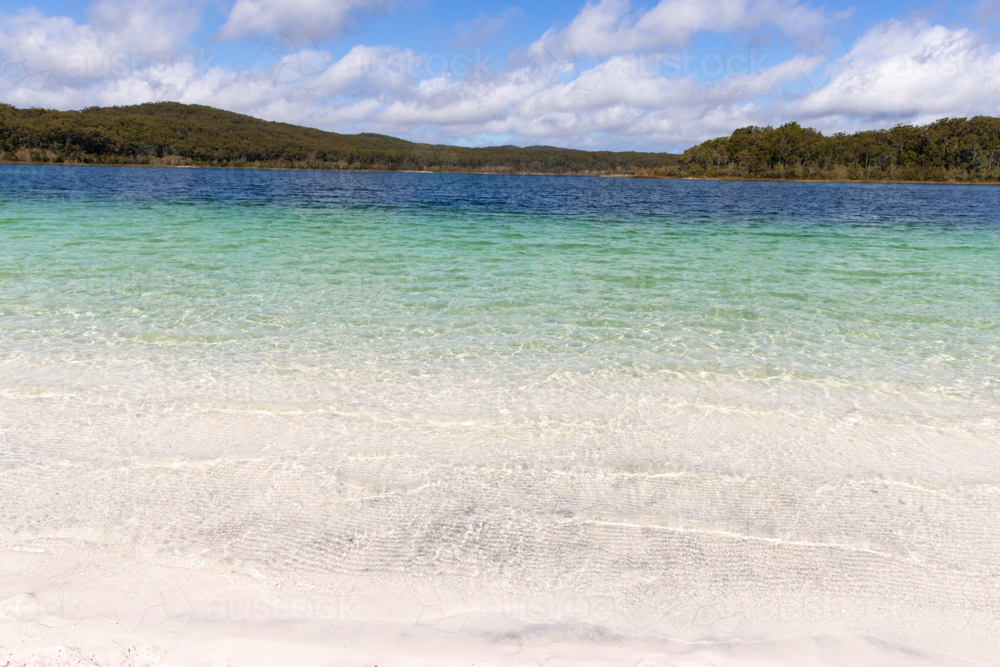 looking across an empty lake on a sunny day - Australian Stock Image