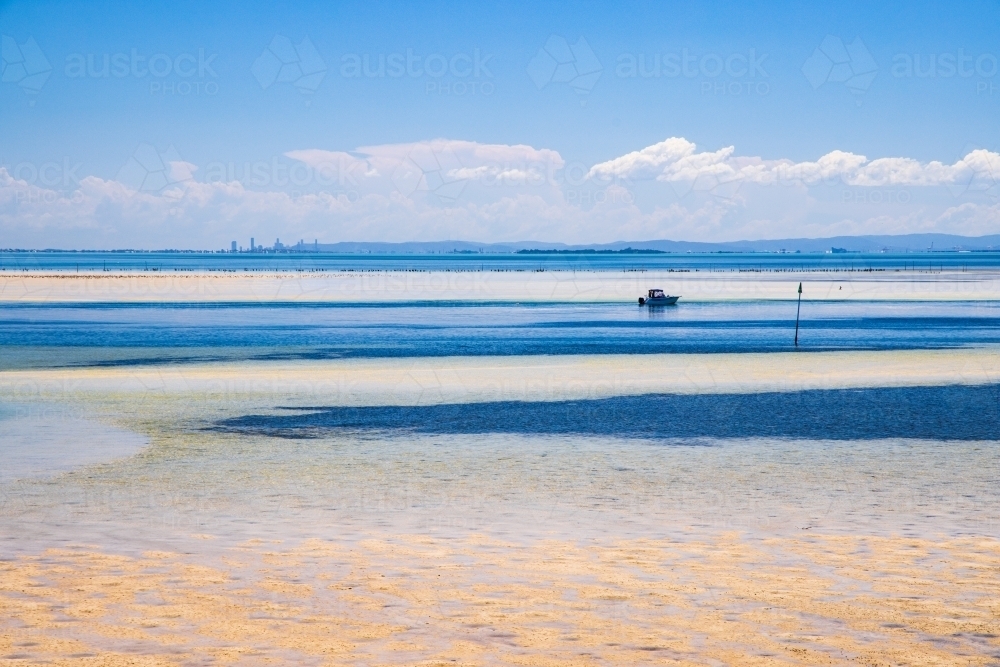 Looking across the waters of Moreton Bay towards Brisbane on a sunny summer day - Australian Stock Image