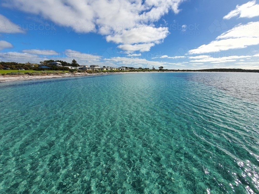 looking across water at seaside town - Australian Stock Image