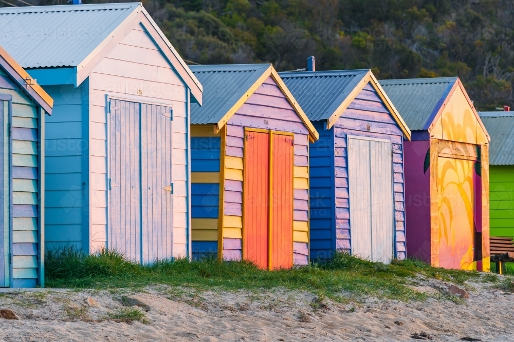 Looking along a row of colorful timber bathing boxes - Australian Stock Image