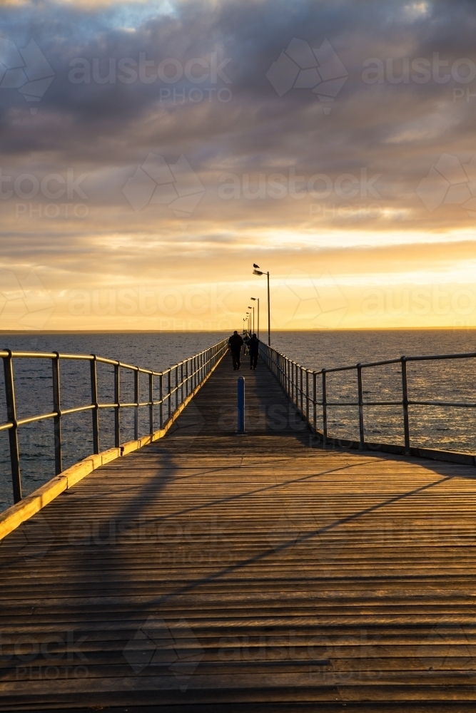 Looking along jetty at sunset - Australian Stock Image