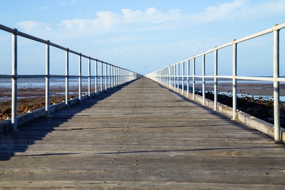 Looking along jetty - horizontal low angle - Australian Stock Image