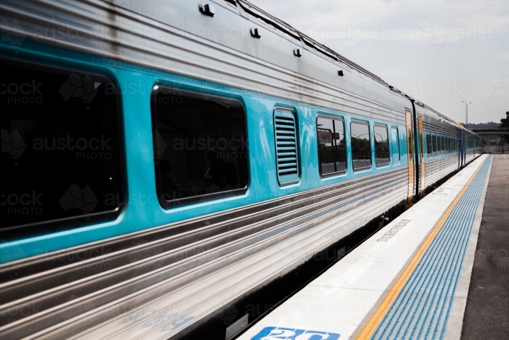 Looking along train and platform on small rural train station - Australian Stock Image