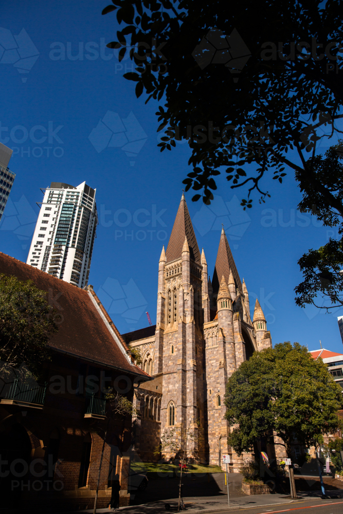 looking at St John's Cathedral in Brisbane city against a blue sky - Australian Stock Image