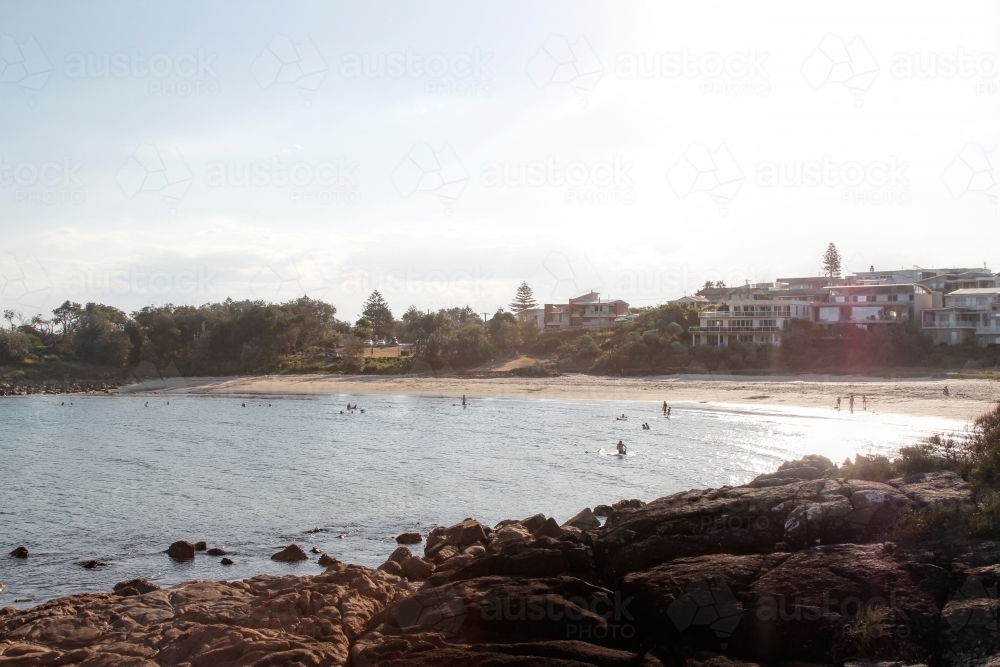 Looking back at beach from rocky shoreline - Australian Stock Image