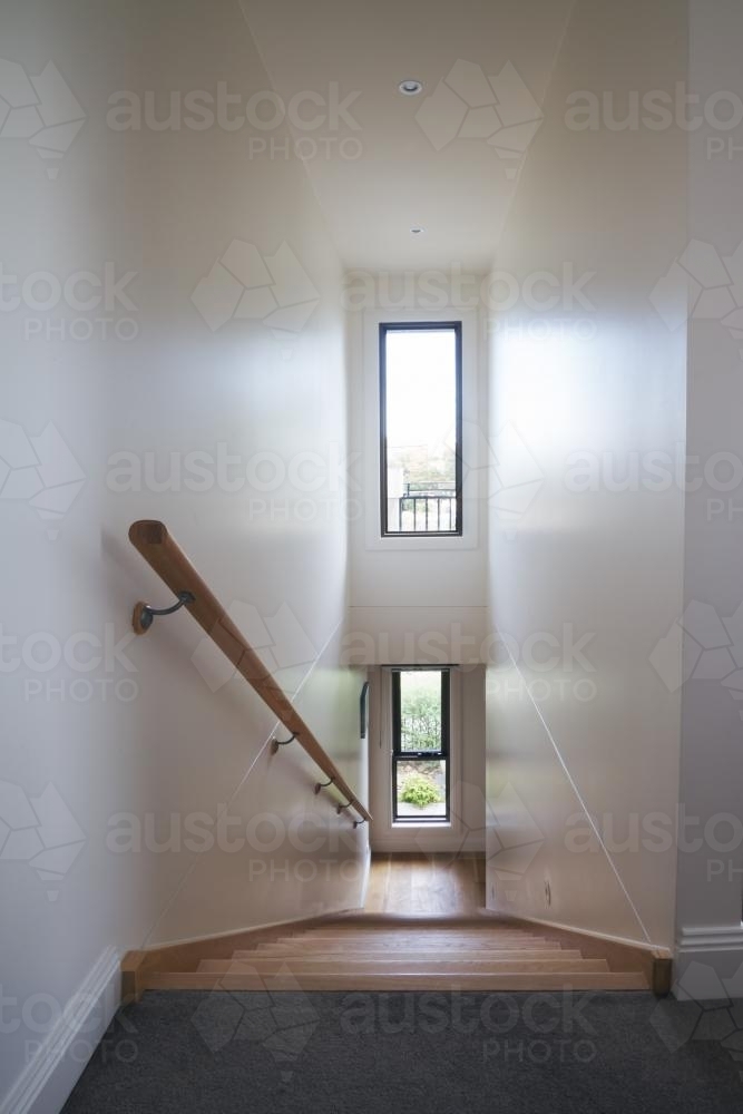 Looking down a contemporary staircase in a luxury home - Australian Stock Image