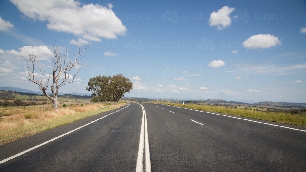 Looking down a road with a bend - Australian Stock Image