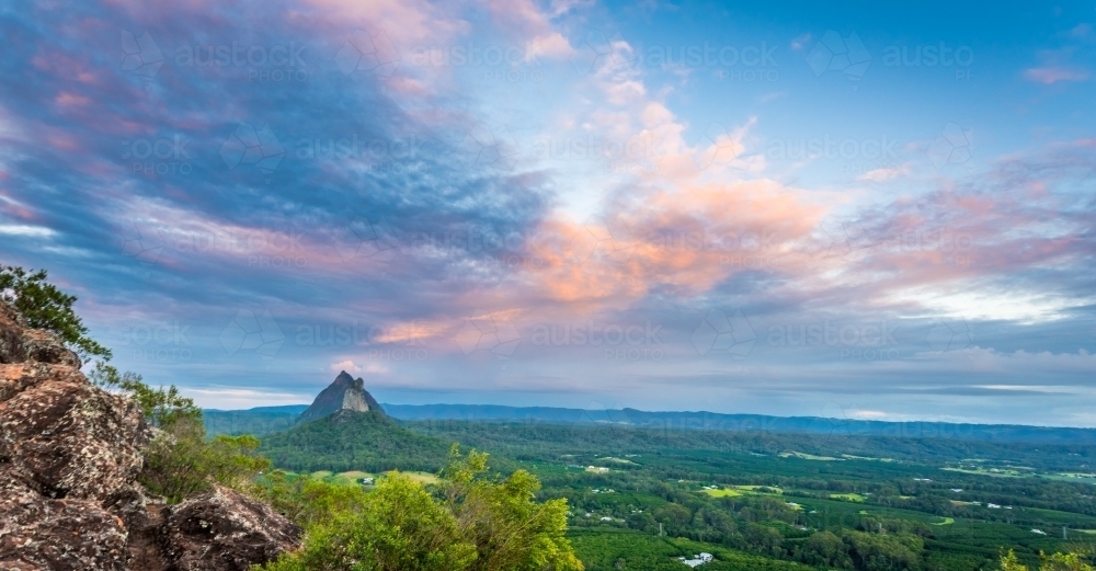Looking down at green valley and mountain - Australian Stock Image