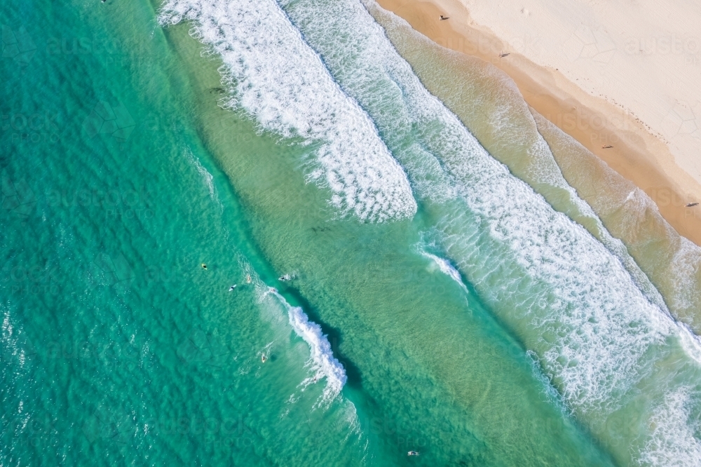 Looking down at paddler boarders in the surf - Australian Stock Image