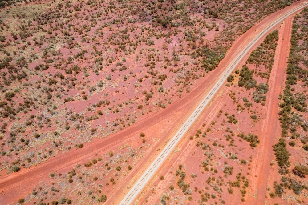 Looking down at red dirt roads going different directions in outback Australia - Australian Stock Image