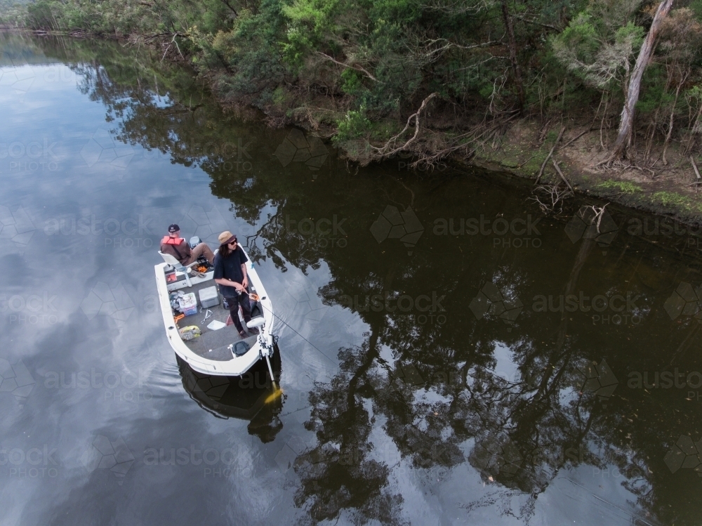 Looking down at Two Fishermen in a Small Boat - Australian Stock Image
