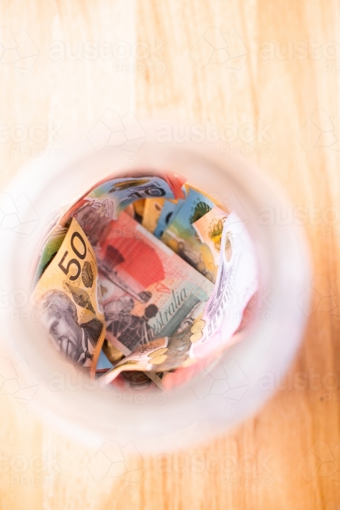 looking down into a jar with Australian notes - Australian Stock Image