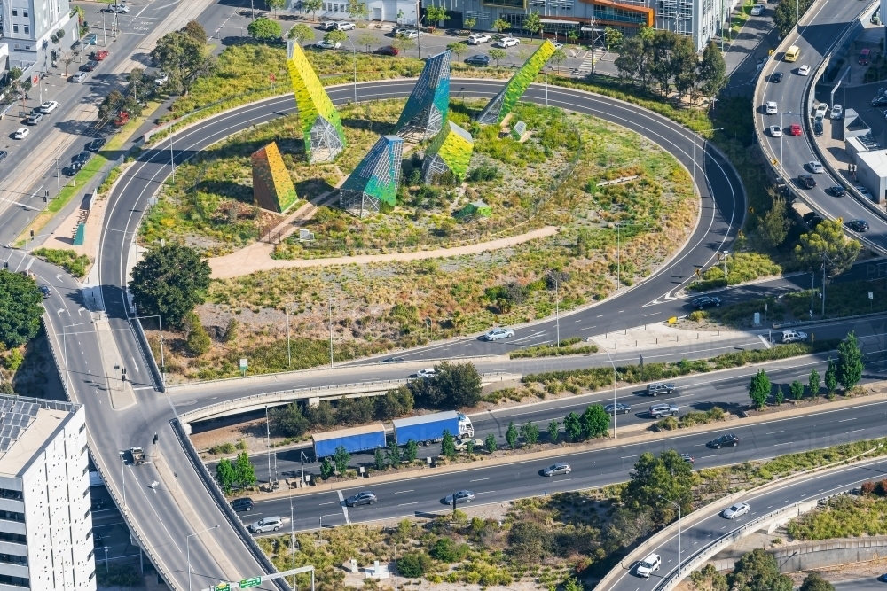 Image of Looking down on a busy freeway with off and on ramps