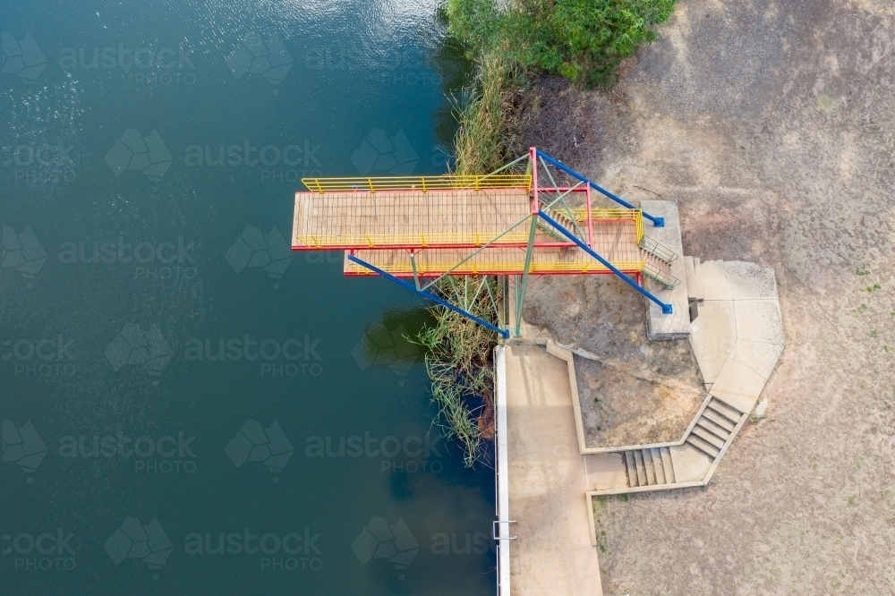 Looking down on a double level diving platform over a lake - Australian Stock Image