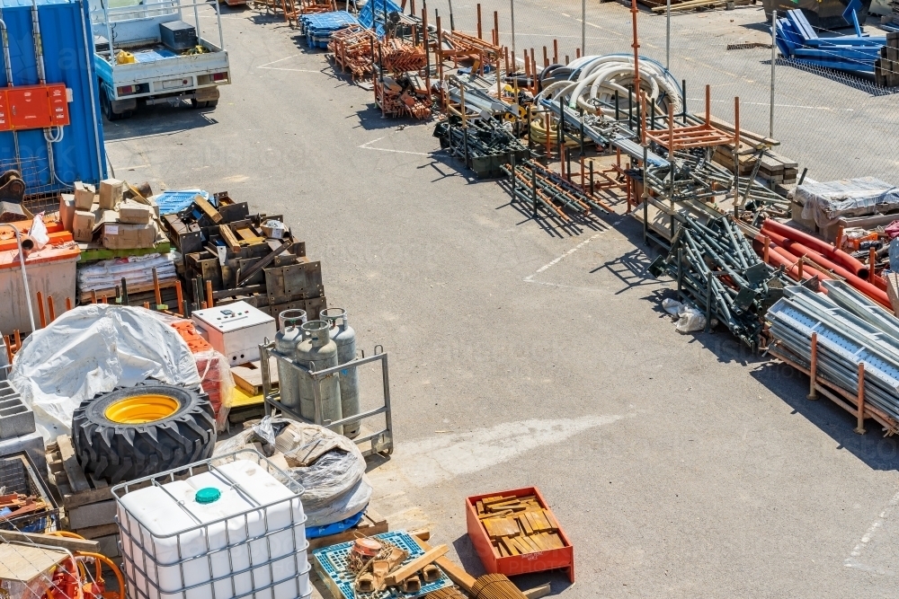 Looking down on construction yard stacked with building materials - Australian Stock Image