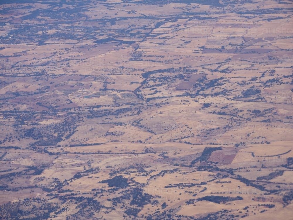 Looking down on dry, undulating, outback hills - Australian Stock Image