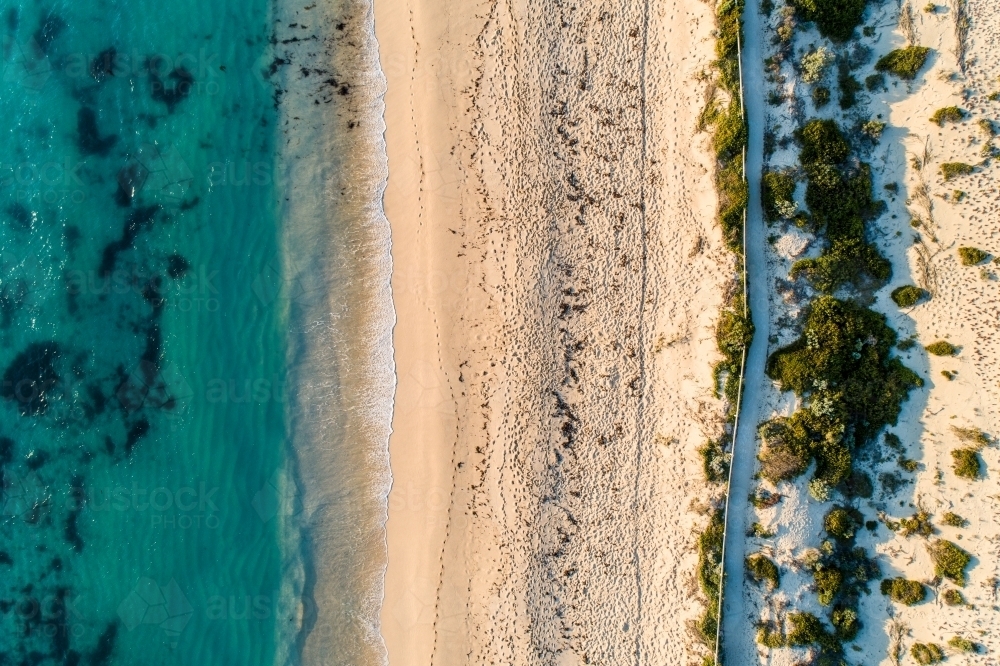 Looking down on ocean, beach, and coastal pathway. - Australian Stock Image