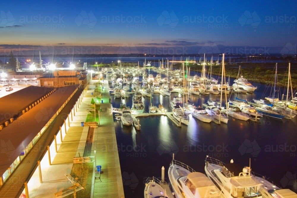 Looking down over a boat marina at twilight - Australian Stock Image