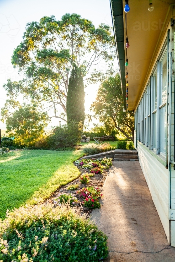 Looking down the side of a farm house and garden - Australian Stock Image