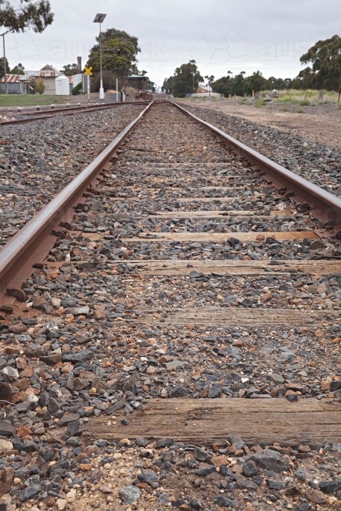 Looking down train track in rural area - Australian Stock Image