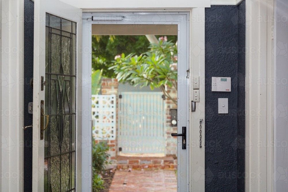 Image Of Looking Out Of House Through Security Door With Alarm