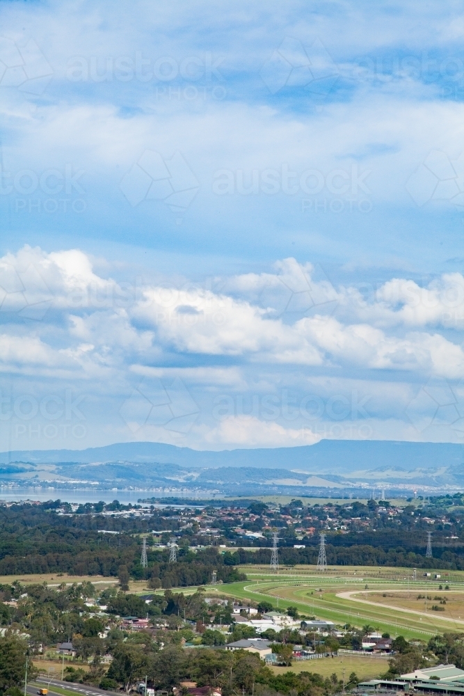 Looking out to Kembla Grange Racecourse and distant hills - Australian Stock Image