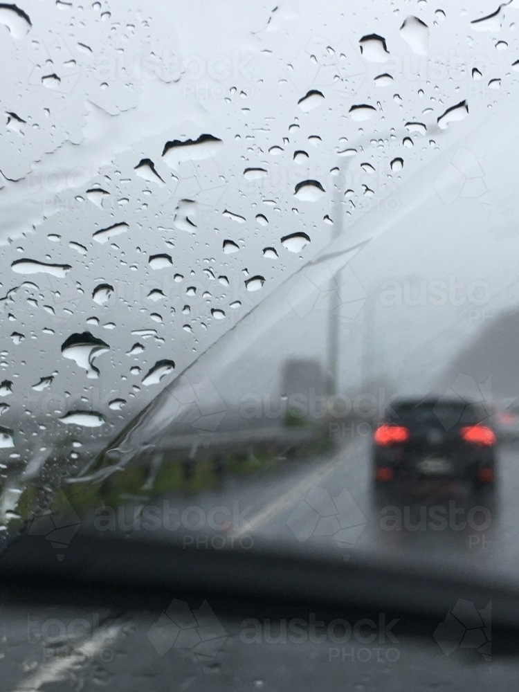 Looking through the window of a moving car in the rain - Australian Stock Image