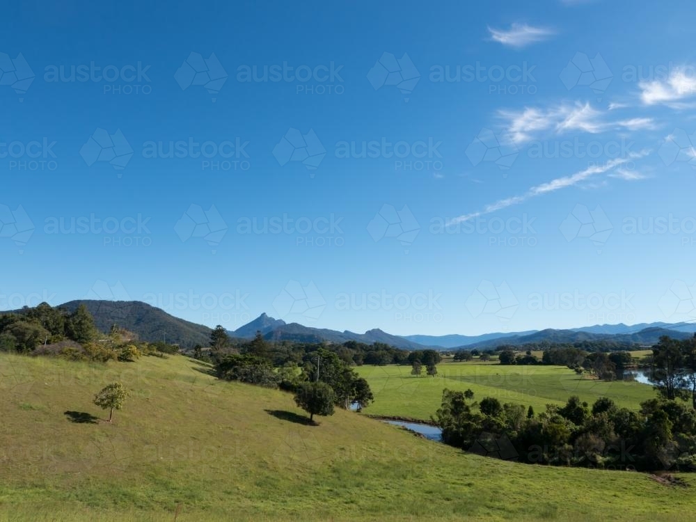 Looking towards Mount Warning and blue sky over green landscape - Australian Stock Image