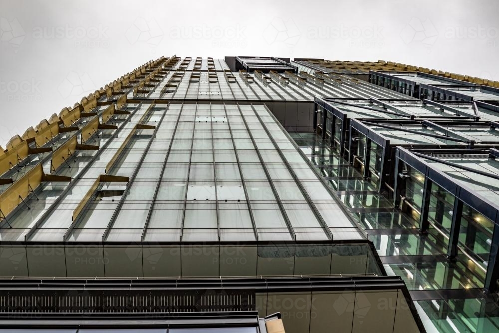 Looking up at a skyscraper on an overcast day - Australian Stock Image