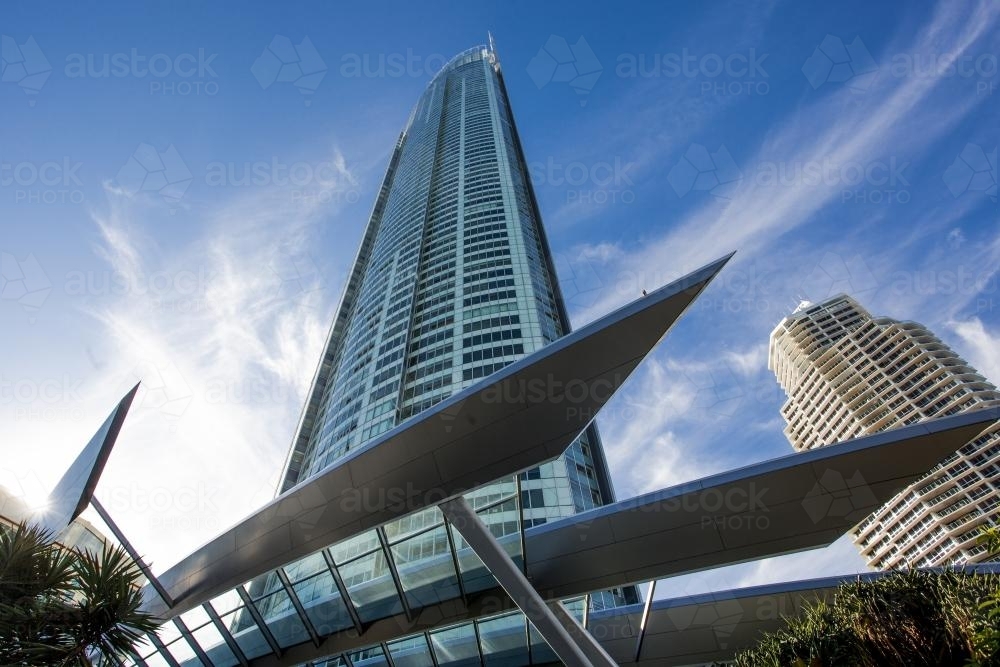 looking up at a skyscraper with blue sky behind - Australian Stock Image