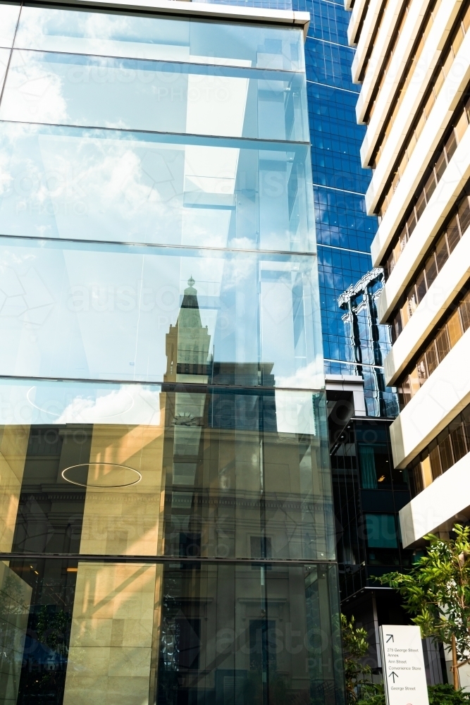 Looking up at high rise city buildings and reflections filling the frame - Australian Stock Image