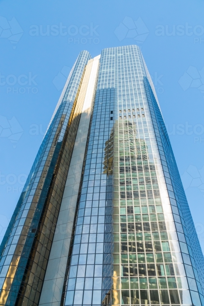 Looking up at reflections on the side of a city skyscraper - Australian Stock Image