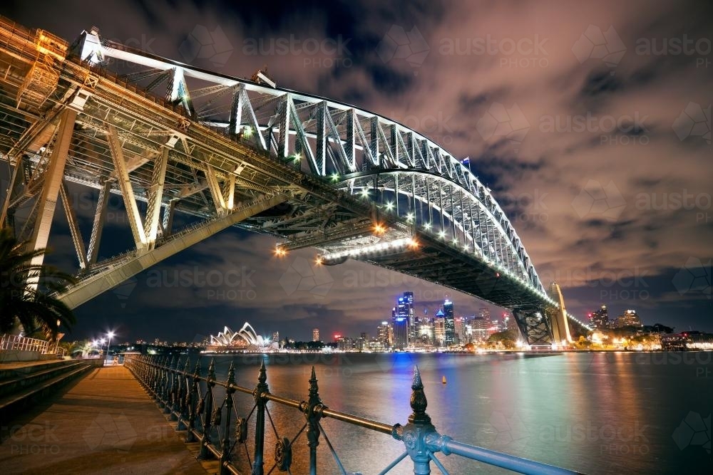 Looking up at the Sydney Harbour Bridge at night - Australian Stock Image