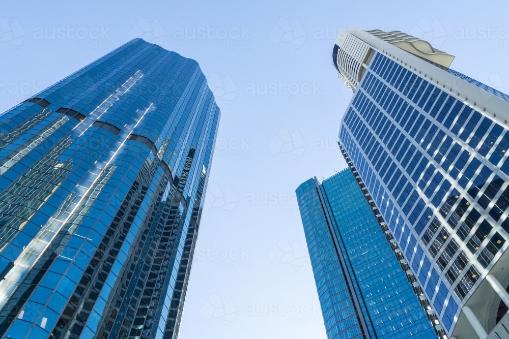 Looking up at two city sky scrapers - Australian Stock Image