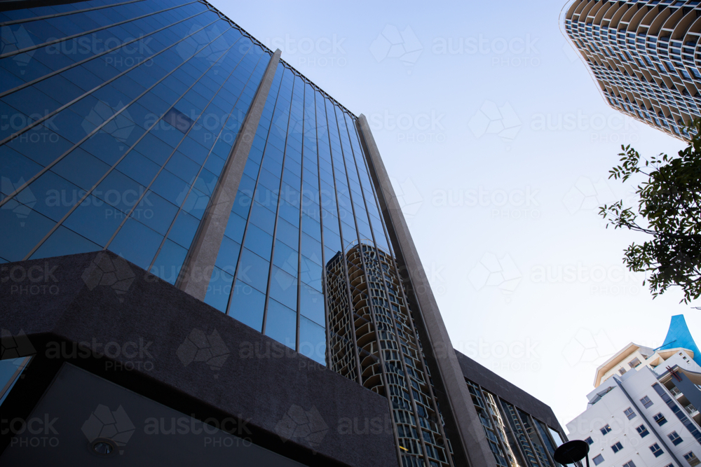 Imposing Looking Image of looking up the imposing glass wall of a city office building ...