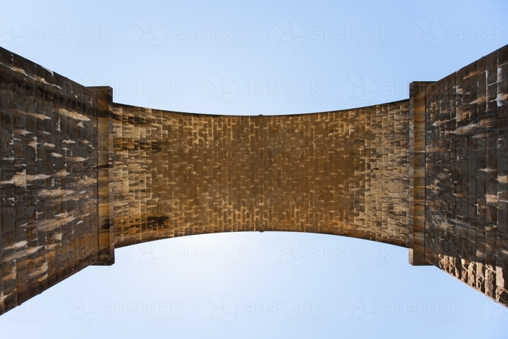 Looking up to the arch of a railway bridge - Australian Stock Image