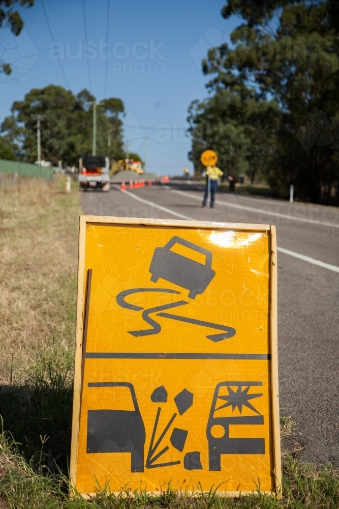 loose rocks sign before road work site - Australian Stock Image
