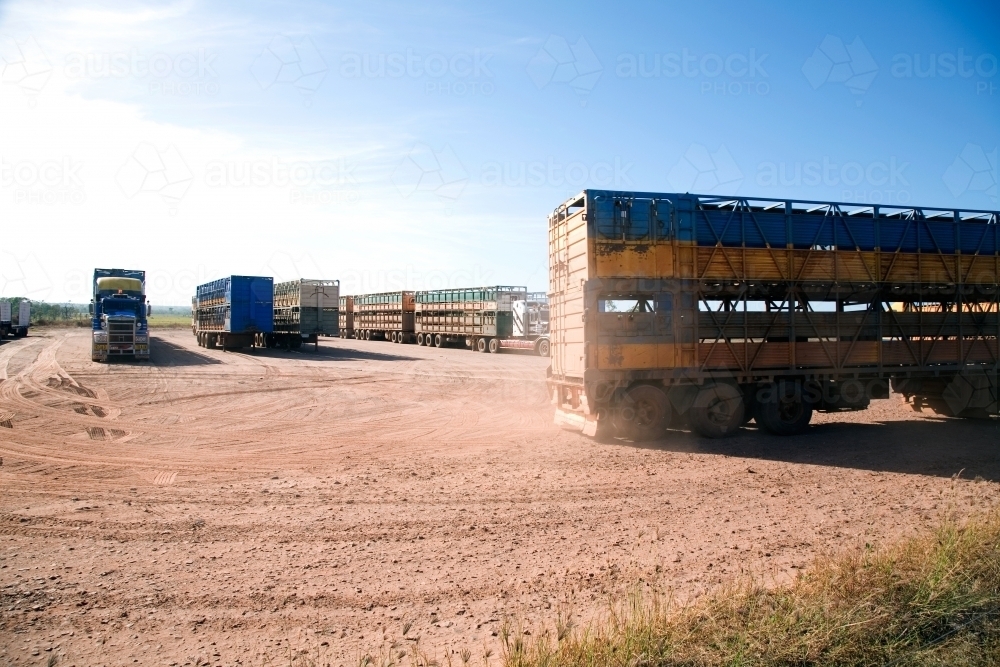 Lorries parked on dirt in outback - Australian Stock Image