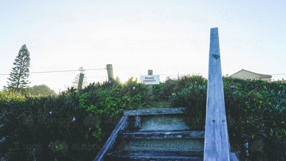 Low angle of beach sign at sunset - Australian Stock Image