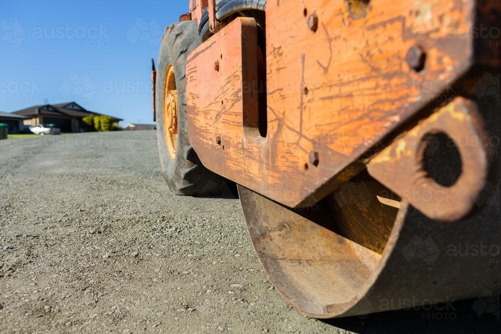 Low angle view of roller-compactor machine for resurfacing a road - Australian Stock Image