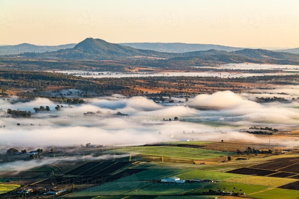 low foggy cloud over rural farming scene - Australian Stock Image